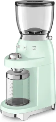 A pastel green Smeg coffee grinder is shown against a white background.