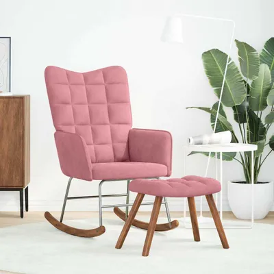 A pink velvet rocking chair and ottoman are shown in a well-lit room with a large plant and a floor lamp.