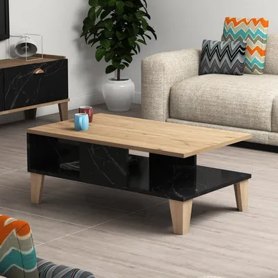 A modern living room setting with a coffee table, couch, and side cabinet.