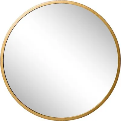 A round mirror with a gold frame.