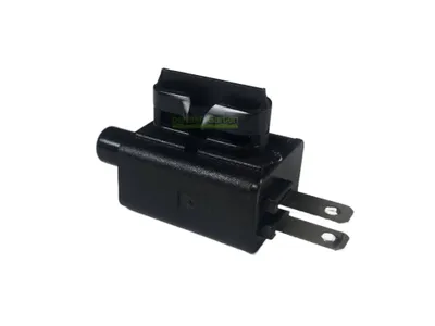 A black electrical component with metal prongs is shown against a white background.
