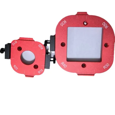 Two red aluminum radius templates for woodworking are shown against a white background.