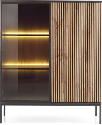 A modern, low display cabinet with a fluted front and glass doors, illuminated shelves, and a black metal frame and legs, presented against a white background.