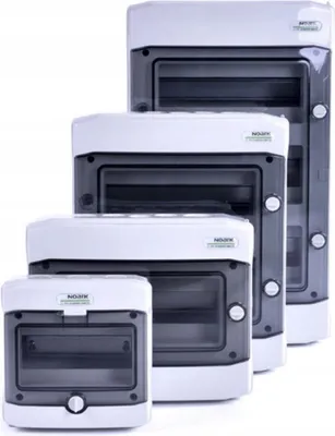 Four electrical distribution boxes of different sizes are arranged diagonally on a white background.