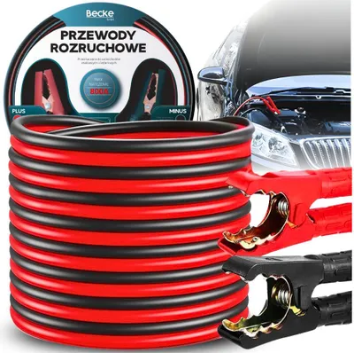 A coiled set of red and black jumper cables is shown in the foreground, with a car engine bay and jumper cable clamps attached to a car battery in the background.
