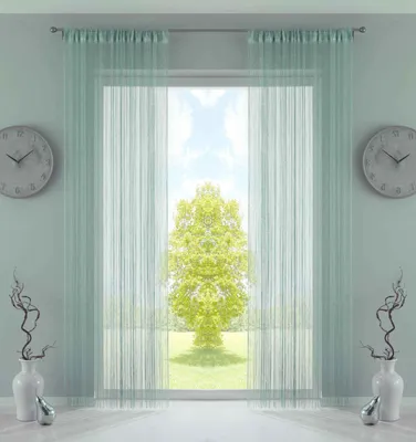 A room interior with a window covered by sheer mint-colored curtains, revealing a bright outdoor scene with a tree.