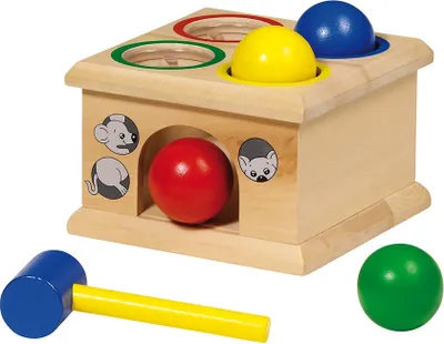 A wooden toy with colorful balls and a hammer.