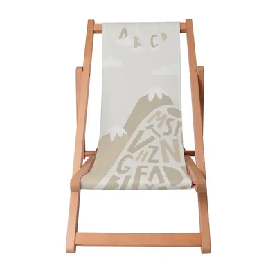 A wooden deck chair with a fabric seat featuring a mountain and alphabet print.