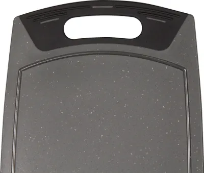 A close-up view of a gray cutting board with a black handle.