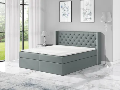 Produktbild von Boxspringbett BARO 120x200 mit 2 Bettkästen, Bonell-Matratze und Topper. Dekorative Stifte an den Seiten der Kopfstütze. Bett Komplett-Set mit Matratze,Bettkasten & Kopfteil. Stoff Eko Cayenne. Elegantes Bett mit massives Kopfteil.