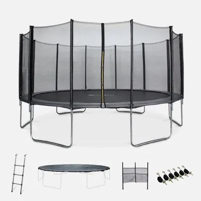 A trampoline with its accessories laid out below it.