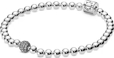 A silver Pandora bracelet with a charm featuring small stones and a clasp with the Pandora logo.