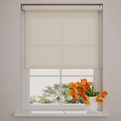 A roller blind is shown covering the top part of a window, with a vase of orange tulips on the windowsill below.