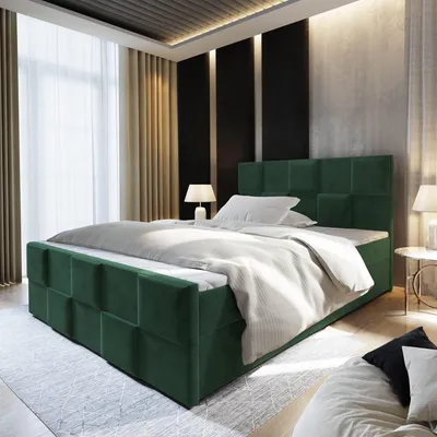 A bedroom with a green upholstered bed.