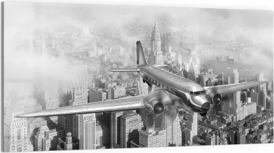 Produktbild von DEQORI Glasbild Echtglas 100x50 cm 'Flugzeug über Stadt' Wandbild Bild modern Deko