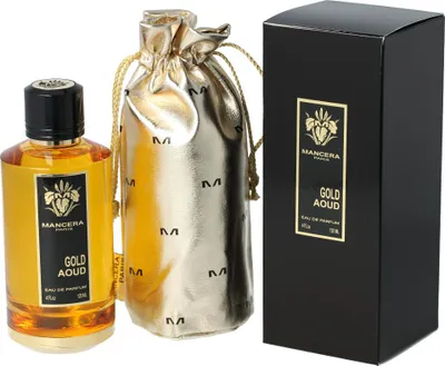 A bottle of Mancera Gold Aoud Eau de Parfum, a gold drawstring pouch, and a black product box are displayed against a white background.
