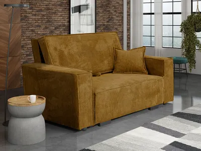 A modern living room with a mustard yellow corduroy sofa, a side table with a cup, and a large window in the background.