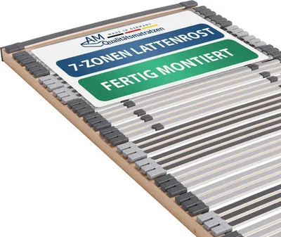 A close-up, angled view of a slatted bed base with informational labels attached.