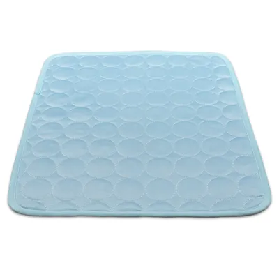 A light blue cooling mat for pets with a circular quilted pattern, shown from a top-down perspective on a white background.