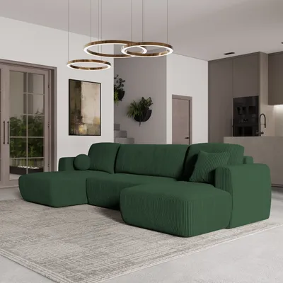 A modern living room with a large green sectional sofa as the focal point.