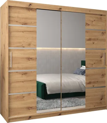 A wardrobe with mirrored doors reflecting a bedroom scene.