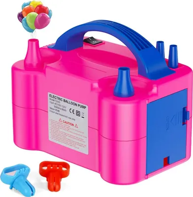 A pink electric balloon pump with blue accents and a blue handle is shown against a white background. Several colorful balloons are depicted floating above one of the pump's nozzles. Two small accessory pieces, one blue and one red, are placed in the foreg