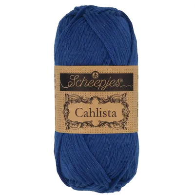 A ball of blue yarn with a brown label.