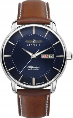 A close-up studio shot of a men's wristwatch with a blue dial and a brown leather strap.