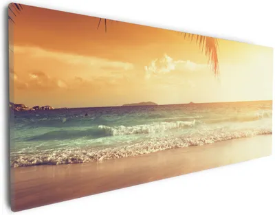 Produktbild von Wallario Premium Leinwandbild Sonnenuntergang am Strand in der Karibik in Größe 30 x 75 cm