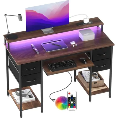 Immagine prodotto di Scrivania da gaming con prese e illuminazione LED, 120x50 cm. Scrivania per computer in legno noce con cassetti e ripiano