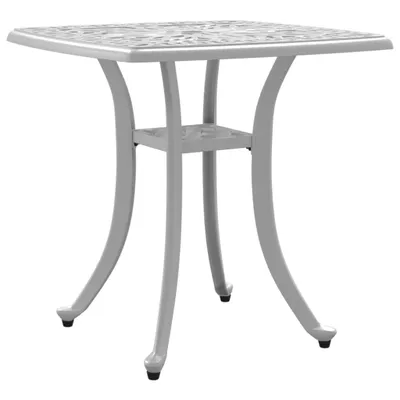 A white cast aluminum garden table with a decorative top and curved legs.