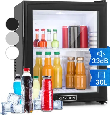 A mini refrigerator filled with various drinks and snacks, with ice cubes in the foreground.