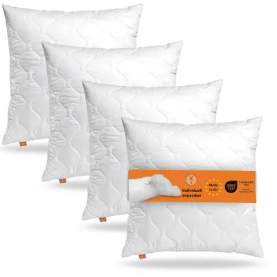 Four white pillows are stacked diagonally on a white background. A band with product information is wrapped around the front pillow.