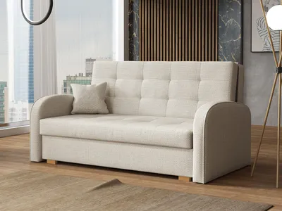 A beige sofa with a single throw pillow is shown in a well-lit room with a large window and modern decor.