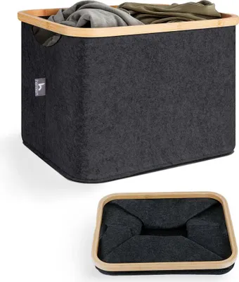 A dark gray felt laundry basket with a bamboo rim, filled with clothes, shown from a slightly elevated angle. A second image below shows the basket folded flat.