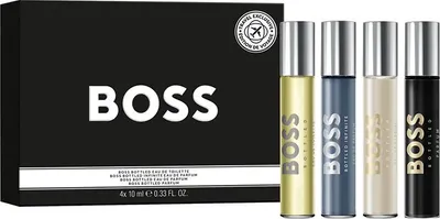 A product shot of a Hugo Boss miniatures set, featuring a black box with the BOSS logo and four perfume rollerballs.