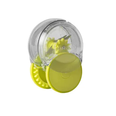 A manual garlic and herb chopper with green wheels and blades, shown against a white background.