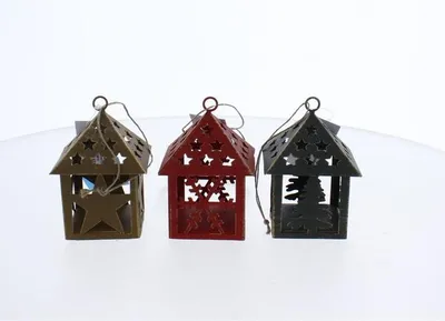 Three small decorative lanterns shaped like houses, each with cut-out designs, are displayed against a white background.