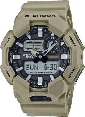 A close-up studio shot of a tan G-Shock watch.