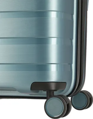 Close-up view of the wheels and bottom corner of a light blue suitcase.