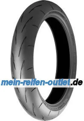 A studio shot of a single motorcycle tire against a white background.