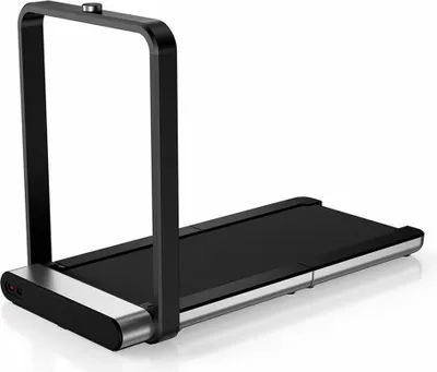 A studio shot of a compact treadmill with a handle.