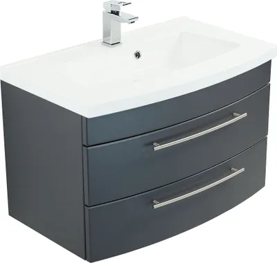 A bathroom vanity with a sink and faucet.