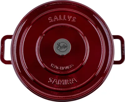 A top-down view of a red cast iron pot.