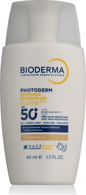 A white bottle of Bioderma sunscreen with text and logos on it.