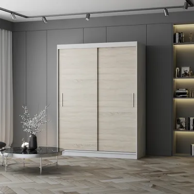 A modern bedroom with a large sliding door wardrobe, a coffee table with a vase of flowers, and a bookshelf.