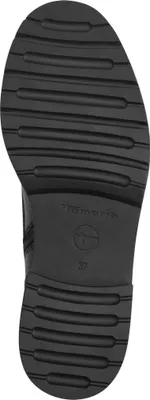The sole of a black shoe is shown against a white background.