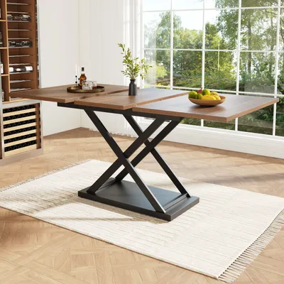 A dining table is set up in a room with a large window overlooking trees. A wine cabinet is visible in the background.
