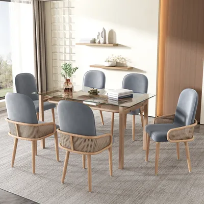 A dining room set with a glass-top table and six chairs.