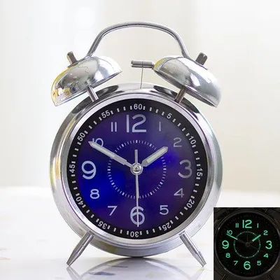 Immagine prodotto di Sveglia analogica con retroilluminazione, blu, alimentata a batteria, ideale per la camera da letto o la scrivania.